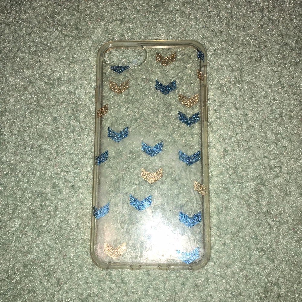 IPhone 6s Clear phone case with gold/blue arrows.